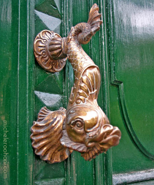 green door with brass carp handle michele roohani